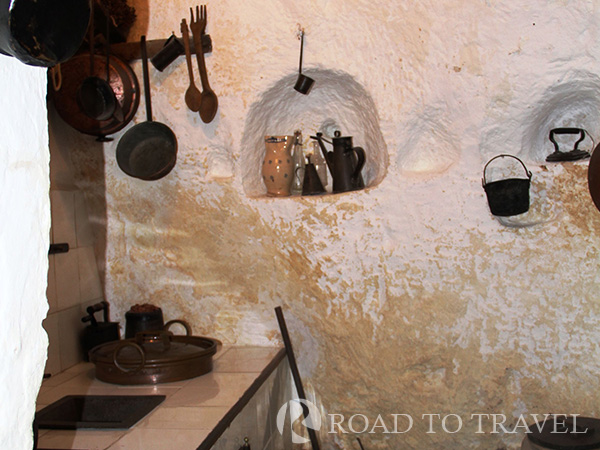 Matera - Casa Grotta Casa Grotta  the family's kitchen. Niches were carved into the cave walls for storage.