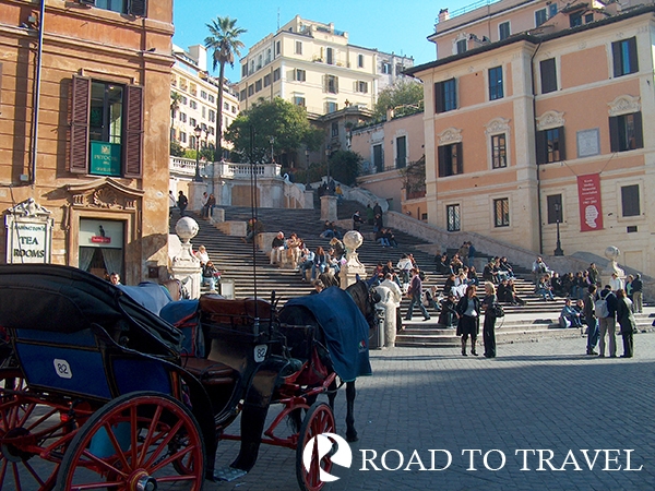 Spanish Steps View of Piazza di Spagna from via del Babbuino. Famous for its fountain shaped like a boat, la Barcaccia, and the Spanish Steps is one of the most photographed places in Rome.