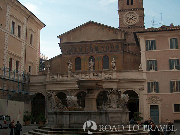 Trastevere The church and the fountain in Piazza Santa Maria in Trastevere Rome.  One of the top 10 things to do I Rome is lovely walking tour of Rome by night from Piazza Navona to Trastevere. This nice walk through the illuminated historical building and tipical bar, restaurants and local vinery takes only 40 minutes. You will pass through Piazza Campo dei Fiori, and Piazza Farnese continue to Palazzo Spada and via dei Pettinari, cross the Tiber on the pedestrian bridge Ponte Sisto and stroll to the narrow typical streets of Trastevere till Piazza Santa Maria in Trastevere.